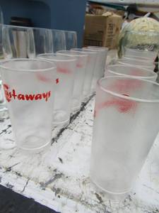 lot 165 image: 5 clear glass short stem wine glasses and 11 castaway plastic cups