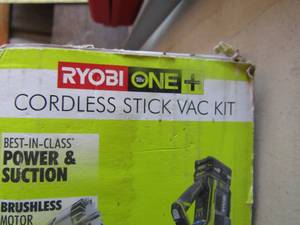 lot 1 image: Ryobi Vacuum cordless stick vauum, also has various parts , unknown working condition