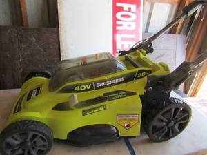 lot 7 image: Ryobi 40 volt brushless electric lawn mower with 1 12 cut to 5 cut, no bag, very nice and clean
