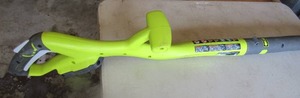 lot 15 image: Ryobi 10 cut battery operated weed eater, uses 18 volt battery, not included