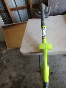 lot 18 image: Ryobi 10 cut battery operated weed eater, uses 18 volt battery, not included