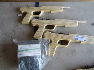lot 62 image: 3 hand made wooden rubber band guns qty 3 plus 2 bags of new rubber bands