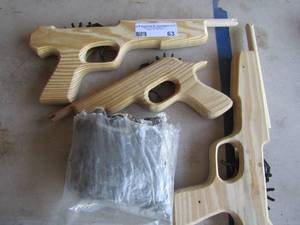 lot 63 image: 3 hand made wooden rubber band guns qty 3 plus 2 bags of new rubber bands