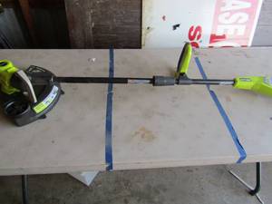 lot 66 image: Ryobi 11thru 13cut battery operated weed eater, 18 volt