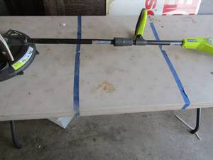 lot 67 image: Ryobi 11thru 13cut battery operated weed eater, 18 volt