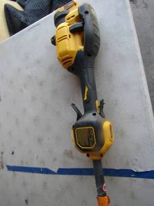 lot 82 image: Dewalt 60 volt brushless weed eater
