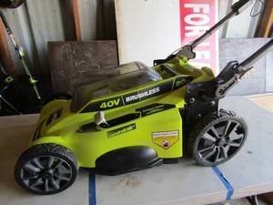 lot 83 image: Ryobi 20 cut 40 volt lawn mower unknown working condition