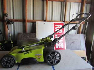 lot 86 image: Ryobi 20 cut 40 volt lawn mower unknown working condition