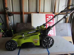 lot 87 image: Ryobi 20 cut 40 volt lawn mower unknown working condition