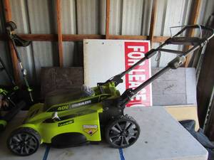 lot 91 image: Ryobi 20 cut 40 volt lawn mower unknown working condition