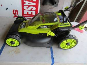 lot 94 image: Ryobi 18 volt 16 cut lawn mower with no top cover, unknown working condition
