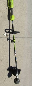 lot 172 image: Ryobi 40 volt weed eater with guard, needs battery- model # RY40006VNM, unknown working condition