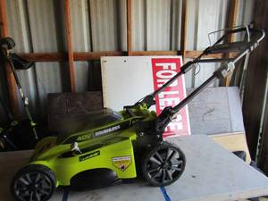 lot 90 image: Ryobi 20 cut 40 volt lawn mower unknown working condition