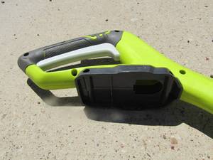 lot 168 image: Ryobi 18 volt model P2003VNM cordless trimmer with out bottom guard