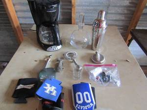 lot 14 image: Hamilton beach 12 cup coffee maker, used but appears only a few times, bar lot includes, drink shaker, bottle top pops, strainer, corks and more all new