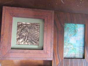 lot 74 image: 88 wood framed Indian head , 97 framed ocean view canvas