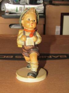 lot 113 image: Mj Hummel figurine from W. Germany- school boy