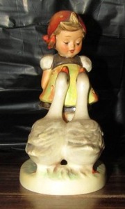 lot 118 image: Mj Hummel figurine from W. Germany- goose girl
