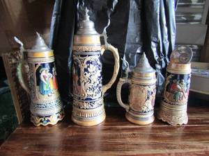 lot 131 image: 13 tall musical stein very nice- Germany 2545 stein name is Wohlbekomms 16 tall-- #694 stein 10 tall-- Valse de Lempereur musical stein broken handle wich is included 13 tall
