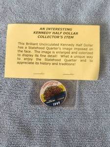 lot 140 image: 1999 - interesting Kennedy Half-Dollar collectors coin - statehood quarters image imposed on face