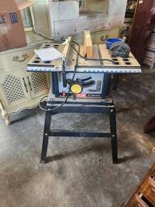 lot 204 image: Ryobi 10inch tab saw with stand
