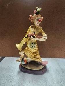 lot 114 image: Vintage clown with gun