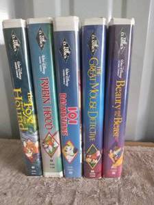 lot 138 image: Selection of 5 Disney VHS Movies including Robin Hood and 101 Dalmations