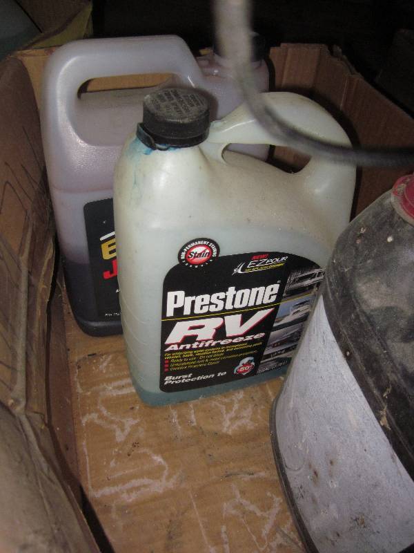 lot 49 image: Anti freeze 1 gal full and 2 partia...