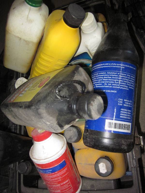 lot 75 image: Misc. oil and transmission  fluid ...