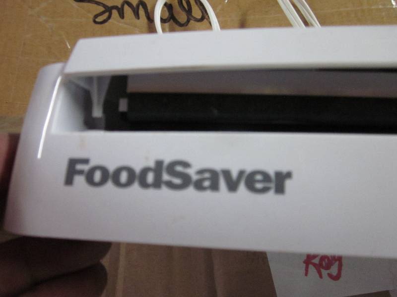 lot 89 image: food saver with assorted small bags...