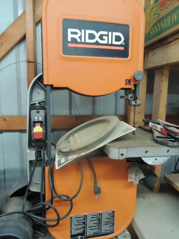 lot 12 image: Ridgid band saw with extra ridged s...