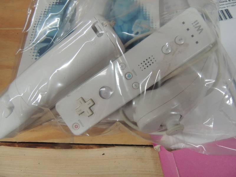 lot 252 image: Wii nunchuk and 2 Wii remotes...