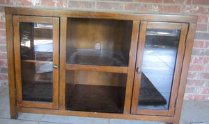 lot 30 image: Double glass door entertainment center with center storage size - 32x48x17