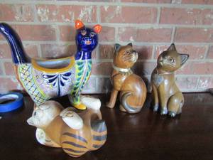 lot 33 image: Mexico cat ceramic 12x12, wooden cat 11, wooden cat on its back 10x5 12, cat looking backwards 10