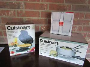 lot 38 image: NIB Cuisinart electric fondue set,   NIB Cuisinart classic stainless steel round waffle maker , NIB 4 clear glass cups   times the $$