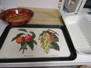 lot 69 image: Wooden cutting board, veggie strainer, fruit platters qty 2, 1 large red bowl