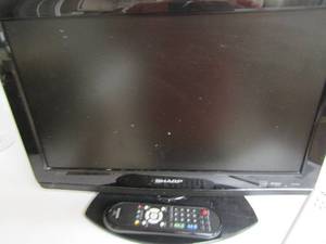 lot 71 image: 19 sharp tv with remote and original pw