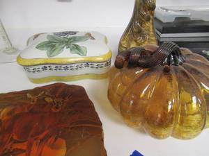 lot 80 image: painted marble rock with deer dcor, fall glass pumpkin, brown glass pumpkin