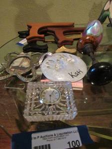 lot 100 image: Crystal Waterford clock, cat feet prints, mini cat book, plate holders and more