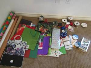 lot 145 image: gift bags, wrapping paper, and ribbon some new some used