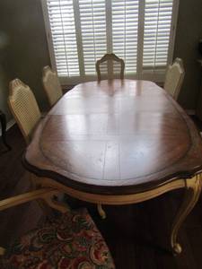 lot 248 image: Solid wood dining table in great condition also has 6 floral padded seat, kitchen chairs that match, also comes with 2 leafs-- table with no leaf 306444-- 1 leaf 308244-- 2 leafs 3010044    X $$
