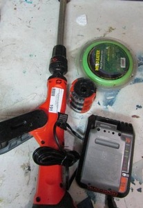 lot 191 image: Black and decker battery operated weed eater trimmer- weed eater string. new and used- extra black and decker charger and battery