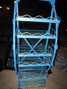 lot 7 image: 6 tier blue and yellow rolling work shop rack, very nice great for small tools or outdoor items such as chemicals