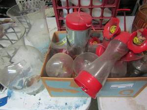 lot 204 image: Lot of humming bird feeders and 2 clear glass vases