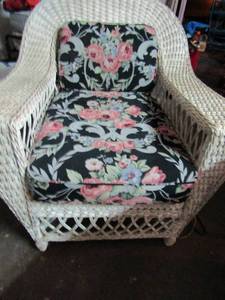 lot 209 image: Large outdoor white wicker chair with floral cushions