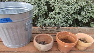 lot 303 image: metal trash can and various plant potters, 1 metal pot stand