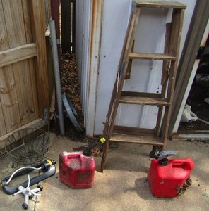 lot 316 image: 3ft step ladder, 3 hanging plant baskets, 2 gas cans, yard water sprinklers