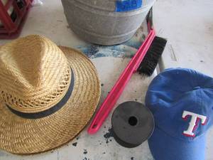 lot 328 image: metal bucket 2 wicker straw sun hats, Texas Rangers baseball cap, various cleaning supplies