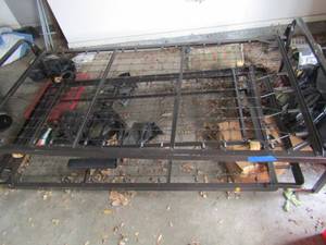 lot 317 image: Twin size trundle bed, pulls out from bottom metal - mattresses not included