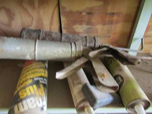 lot 648 image: caulking guns and a can of foam